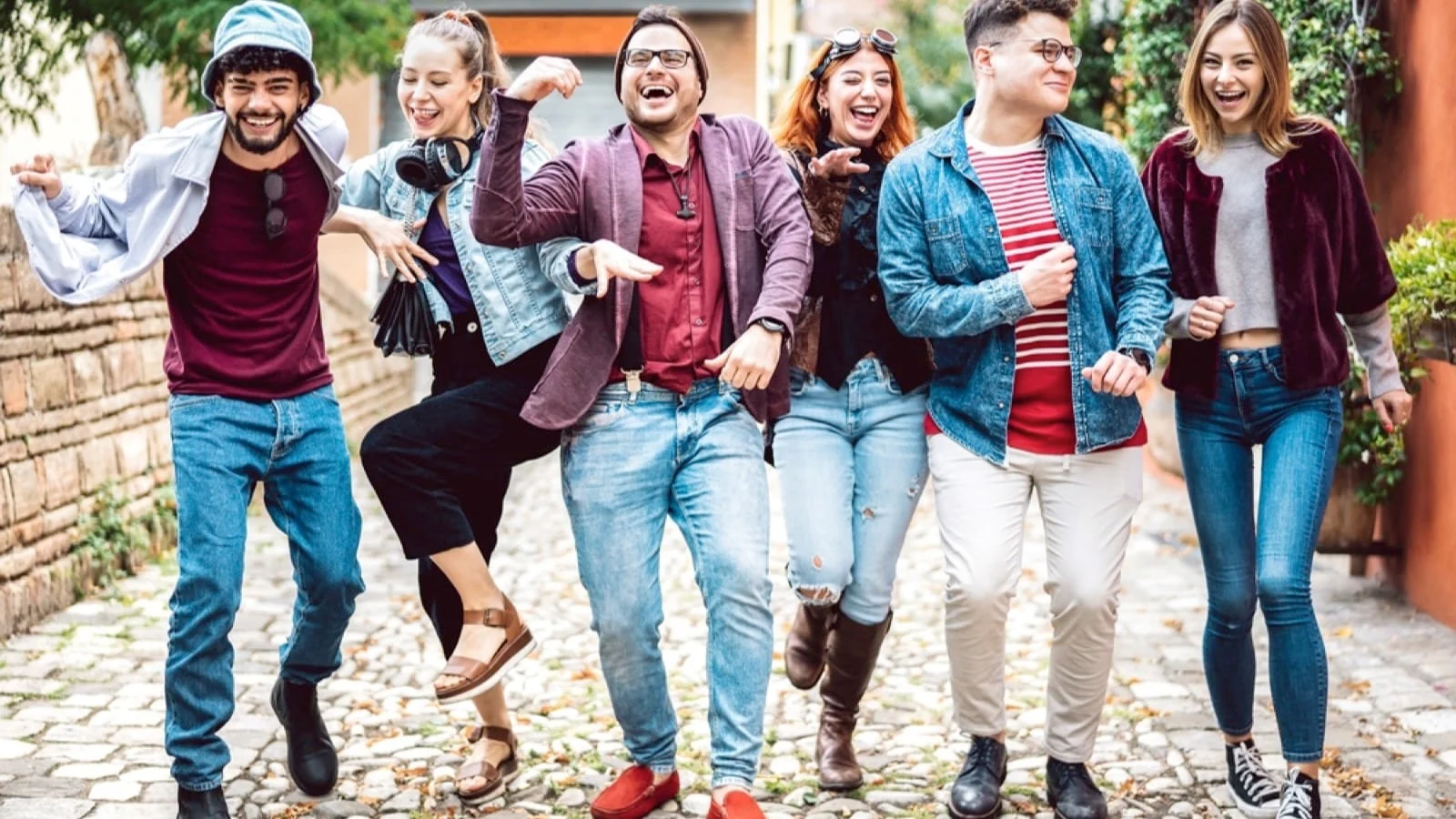 Friends singing, laughing, dancing in public