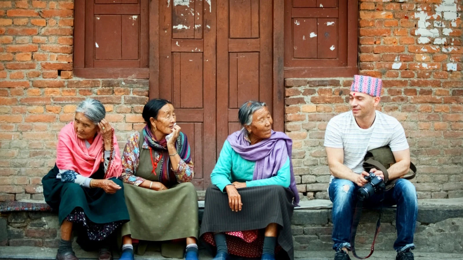 Traveler in Nepal with locals