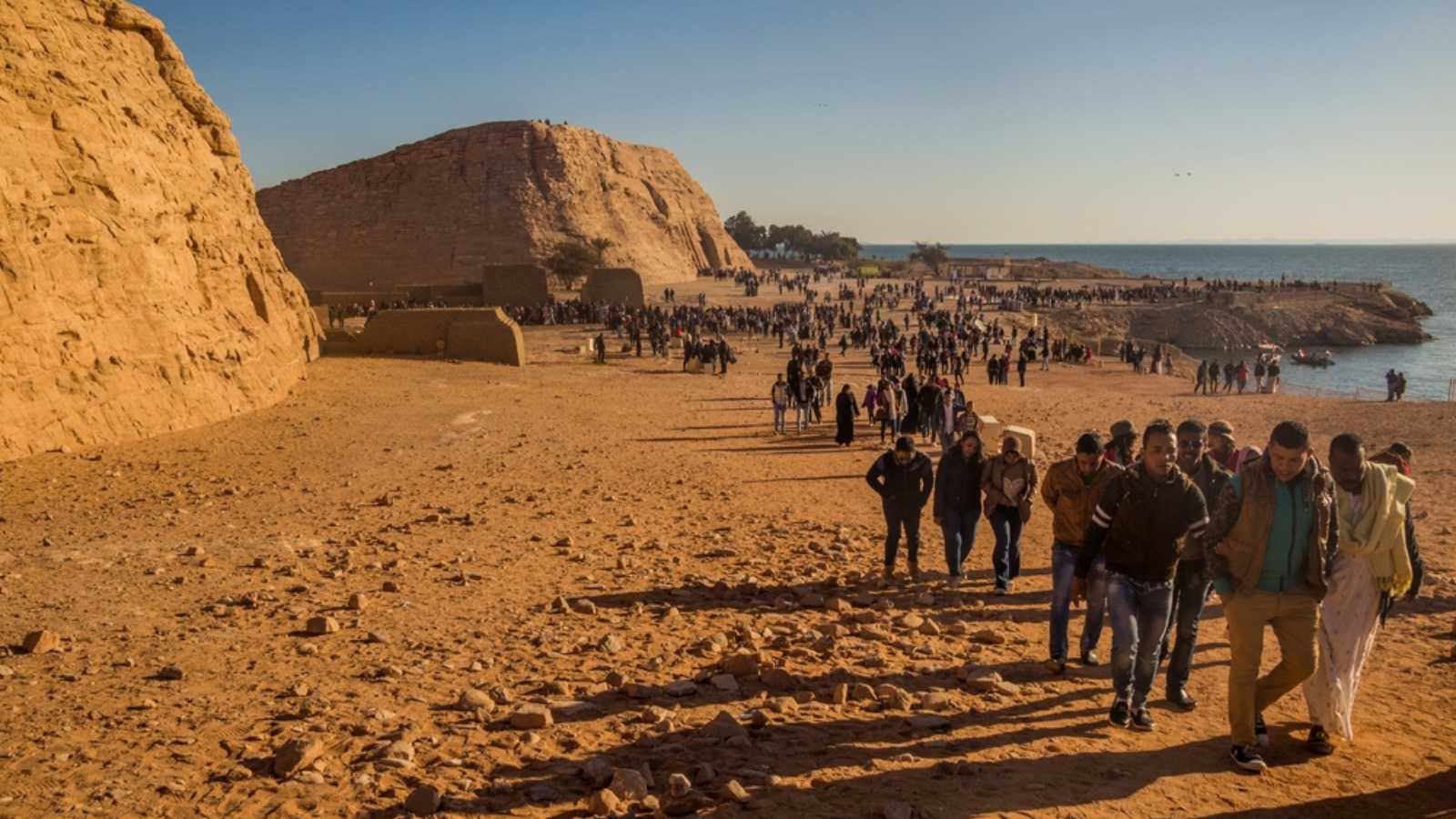 ABU SIMBEL, EGYPT - FEB 22, 2019: People visit the Great Temple of Ramesses II in Abu Simbel, Egypt.