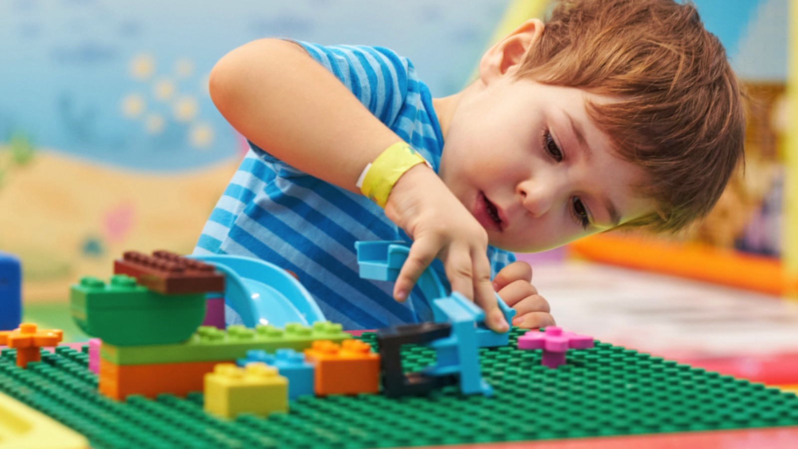 Child playing with LEGO