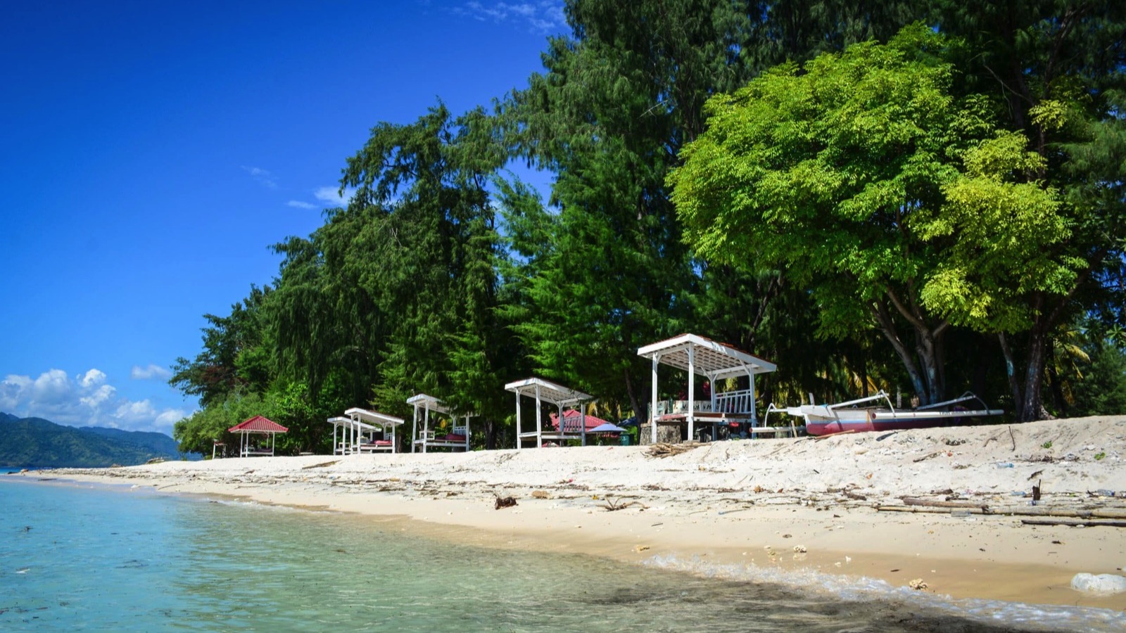 Relaxing houses with green trees on beach at Gili Islands in Lombok, Indonesia