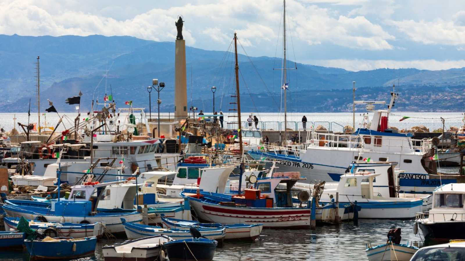 Italy, Sicily, Palermo Province, Santa Flavia. April 11, 2019. Small fishing boats in the harbor of the fishing village of Santa Flavia.