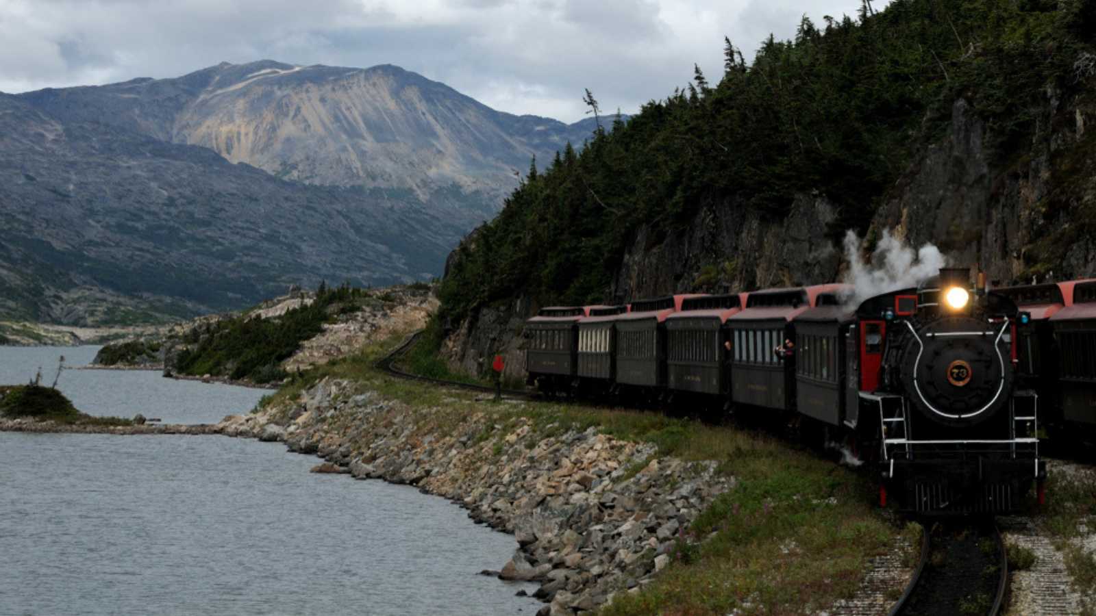 Breathtaking panorama of mountains, glaciers, trestles & tunnels from the comfort of a vintage train, on the White Pass & Yukon Route.