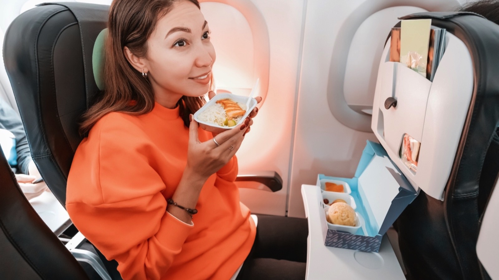 Woman in flight eating