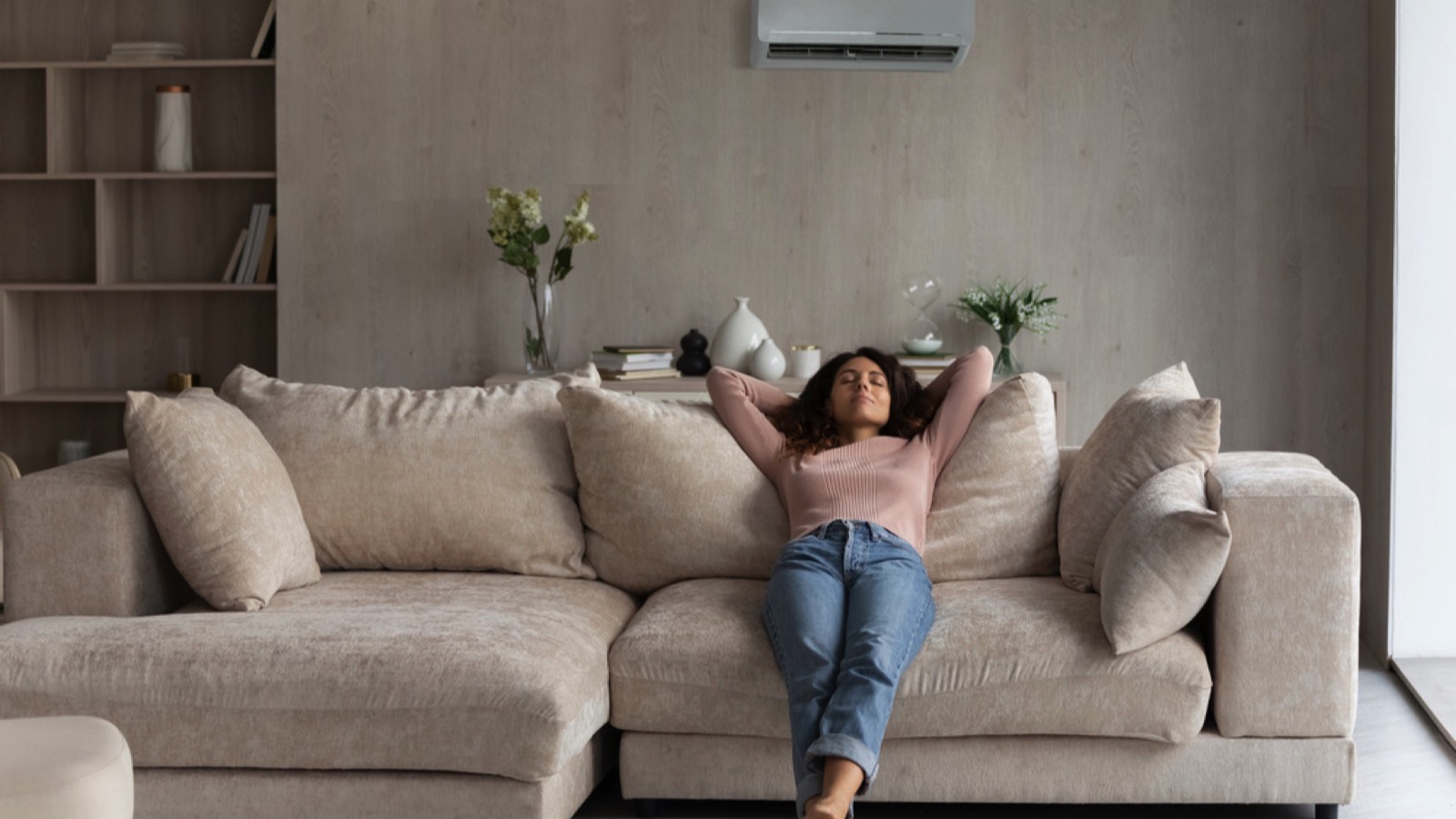 Woman in sofa enjoying AC