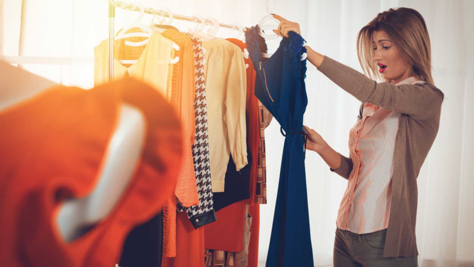 Woman seeing price of dress and shocked