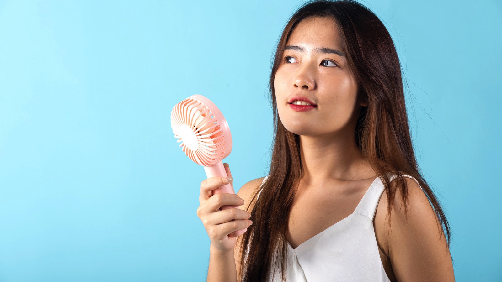 Woman using Portable Fan