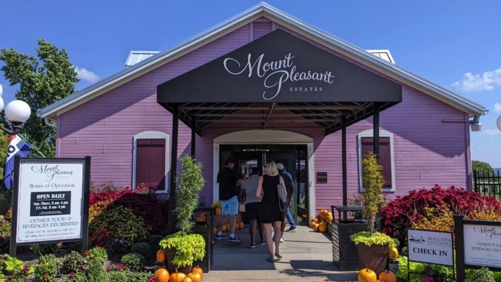 woman walking into winery in augusta is one of the best things to do in missouri