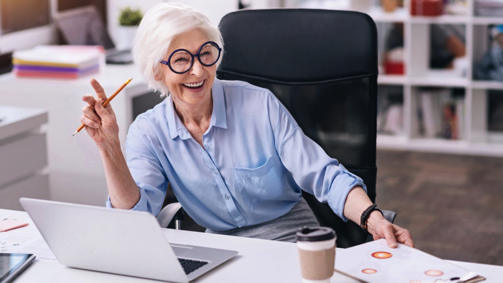 Boomer woman operating laptop