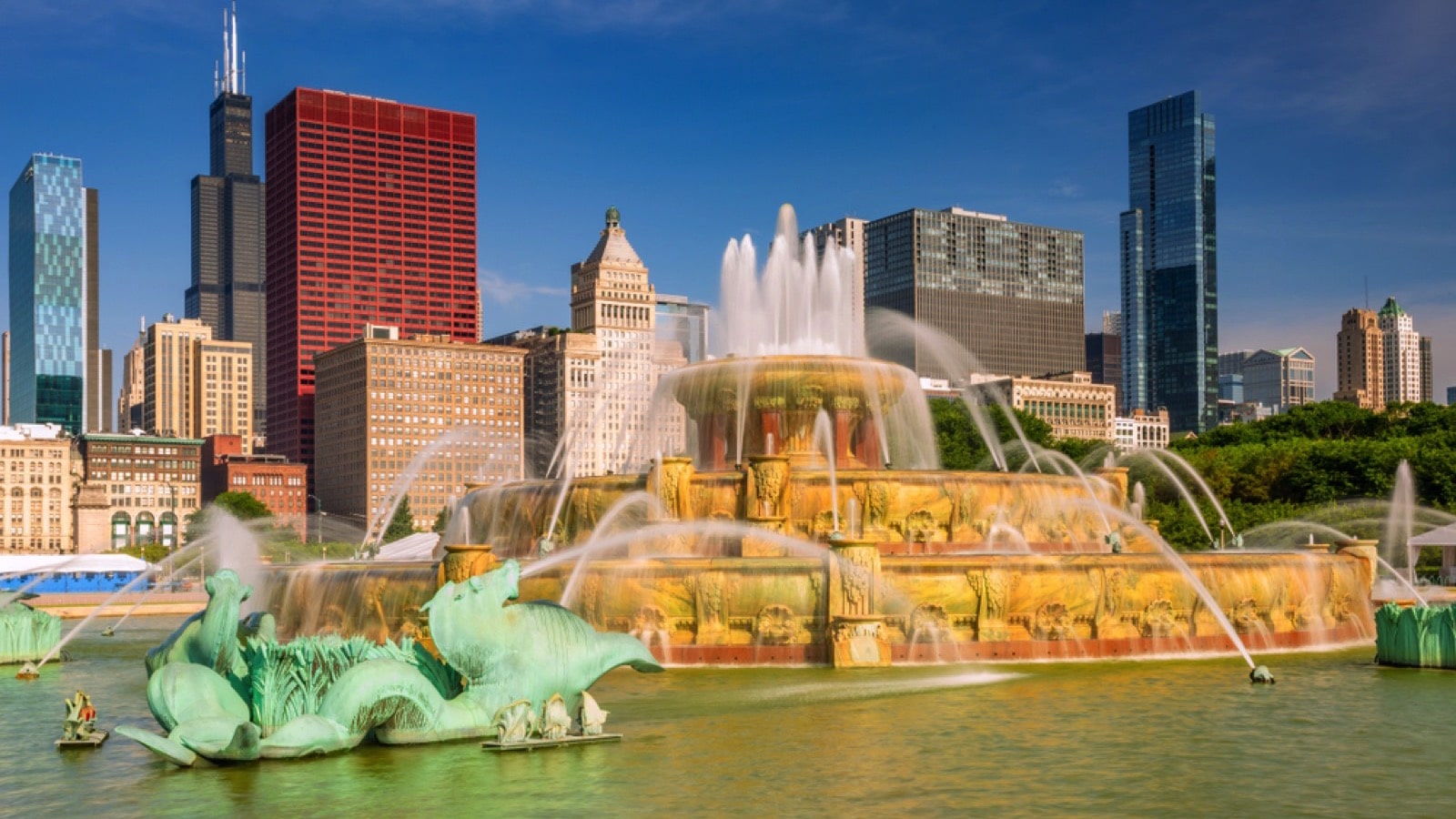 Chicago, USA - July 11, 2019: Chicago's Buckingham Fountain, one of the largest in the world, in the windy city's Grant Park on a beautiful summer day with skyline or buildings in the background.