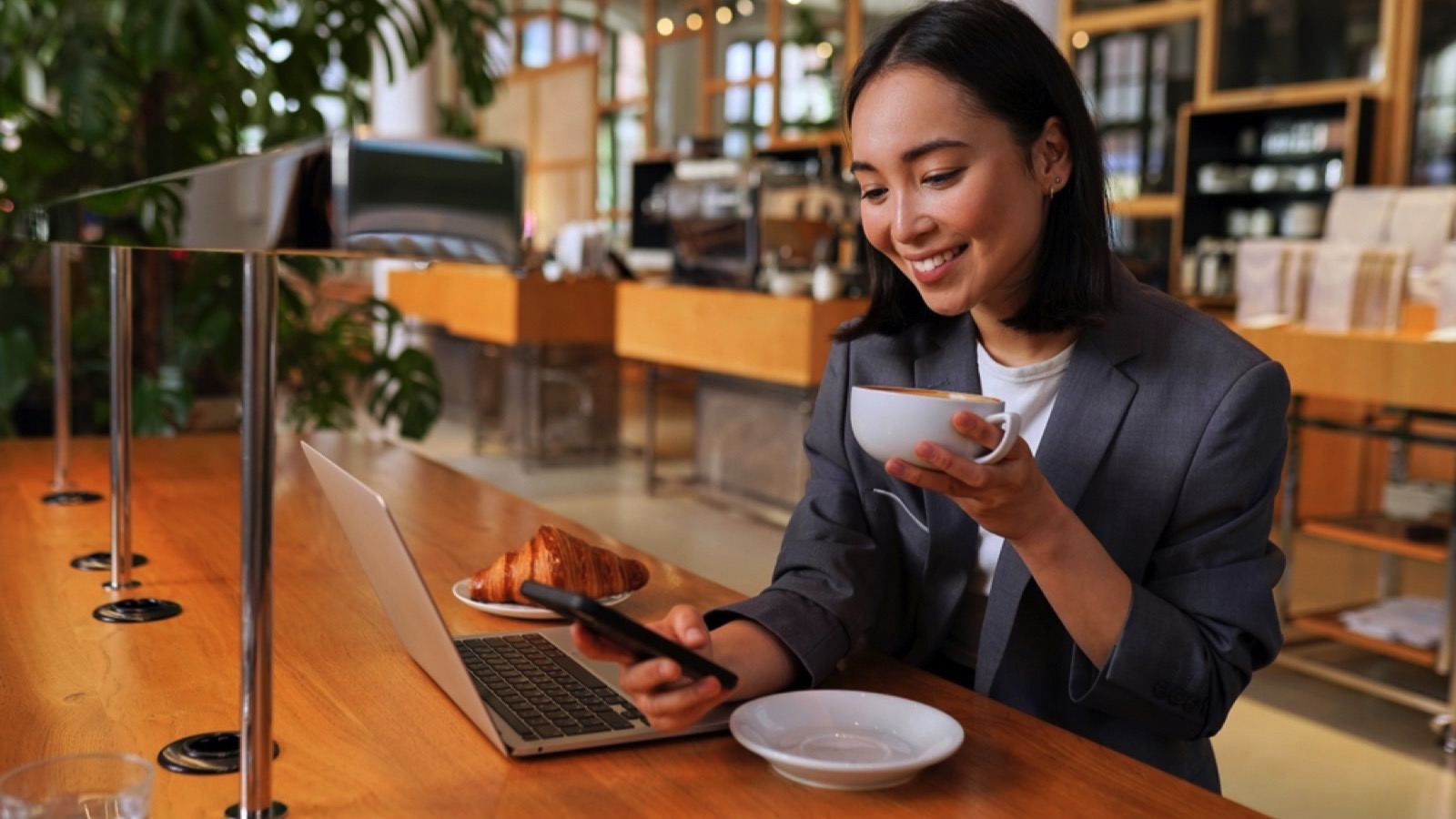 Business woman wearing suit drinking coffee