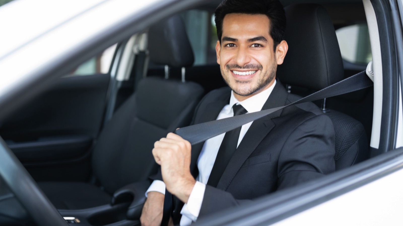 Businessman driving car