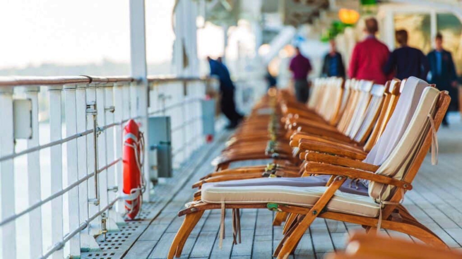 Cruise Ship Wooden Deck Chairs and Some Senior Tourists