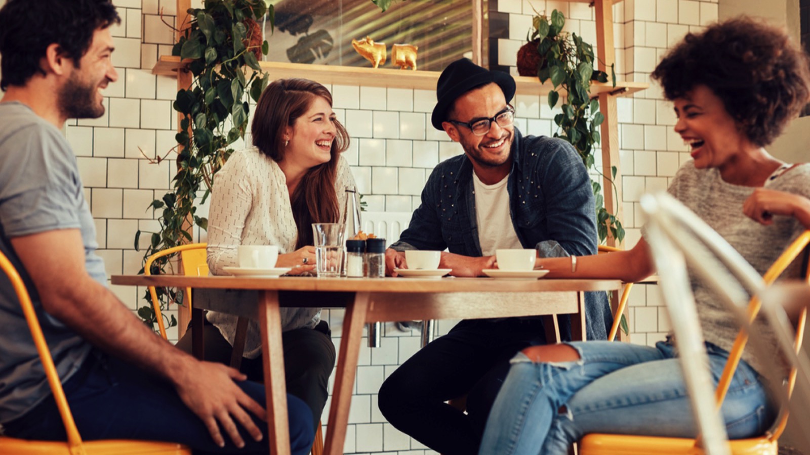 Friends in cafe drinking coffee