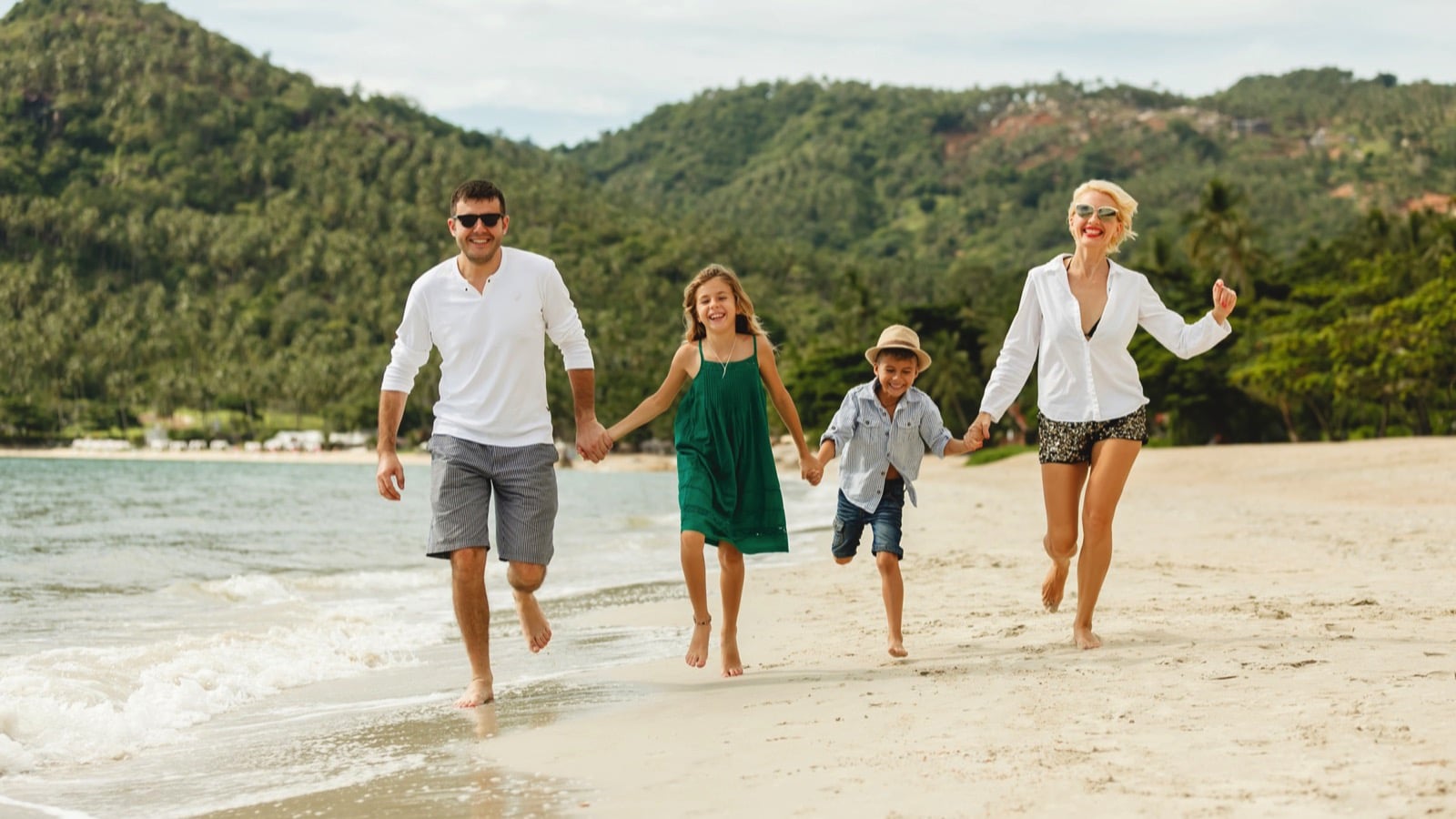 Happy-family-with-kids-enjoying-in-island