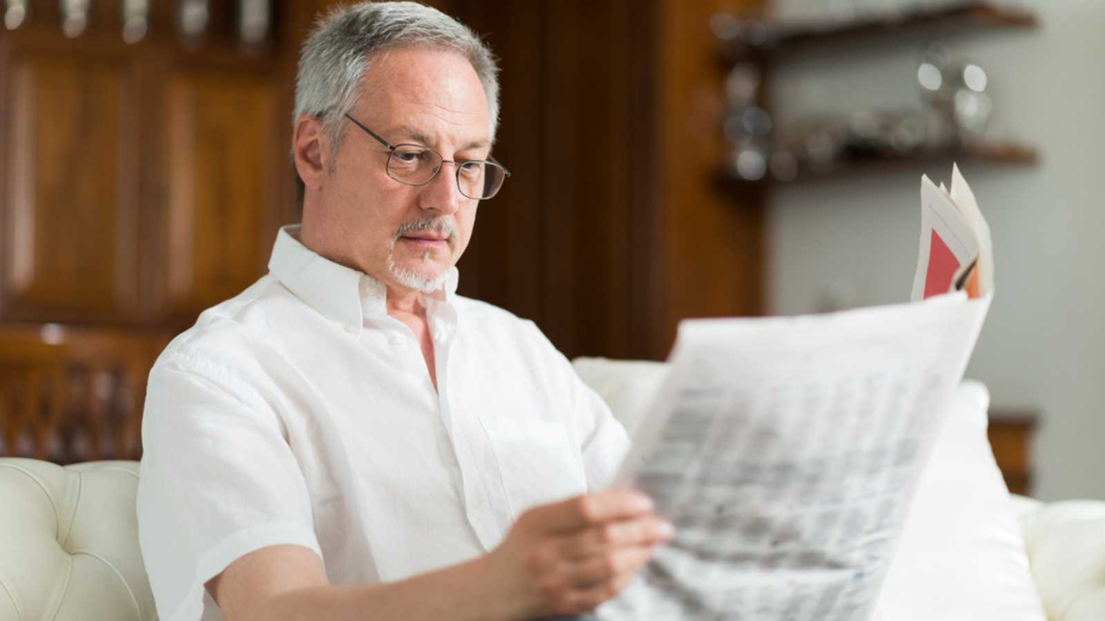 Man reading newspaper