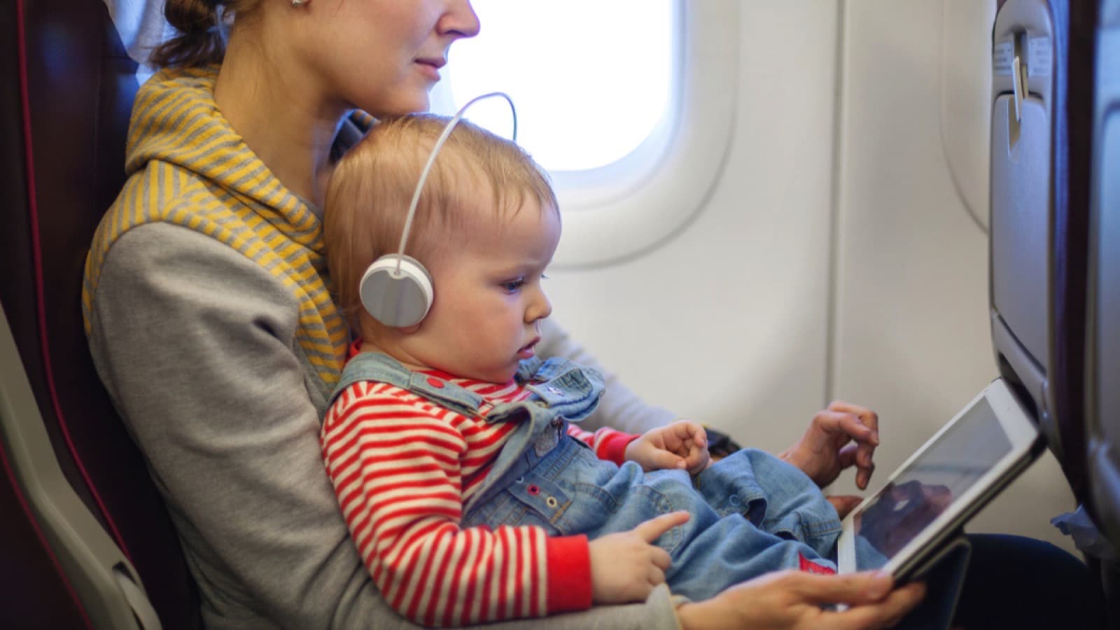 Mother-and-baby-watching-ipad-in-flight