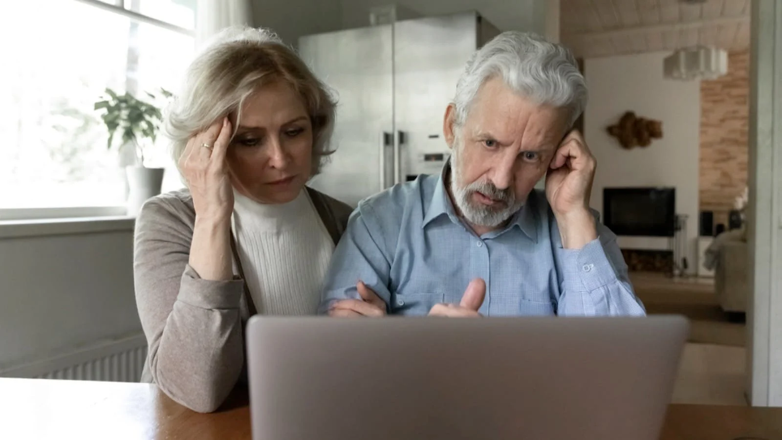 Old couples thinking about debt