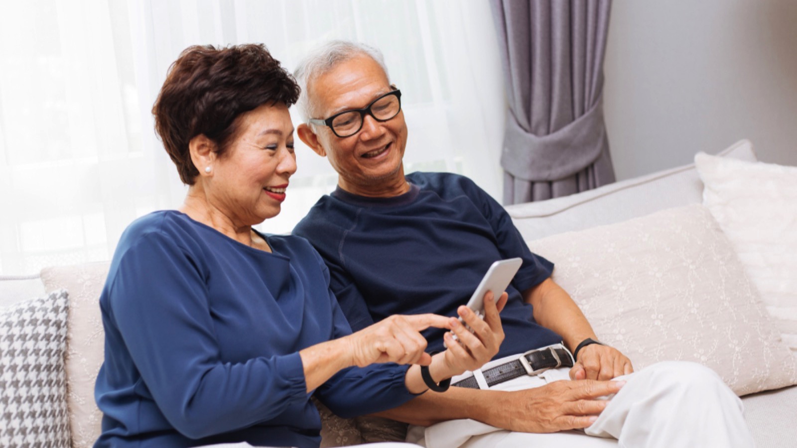 Senior couples using smart phone