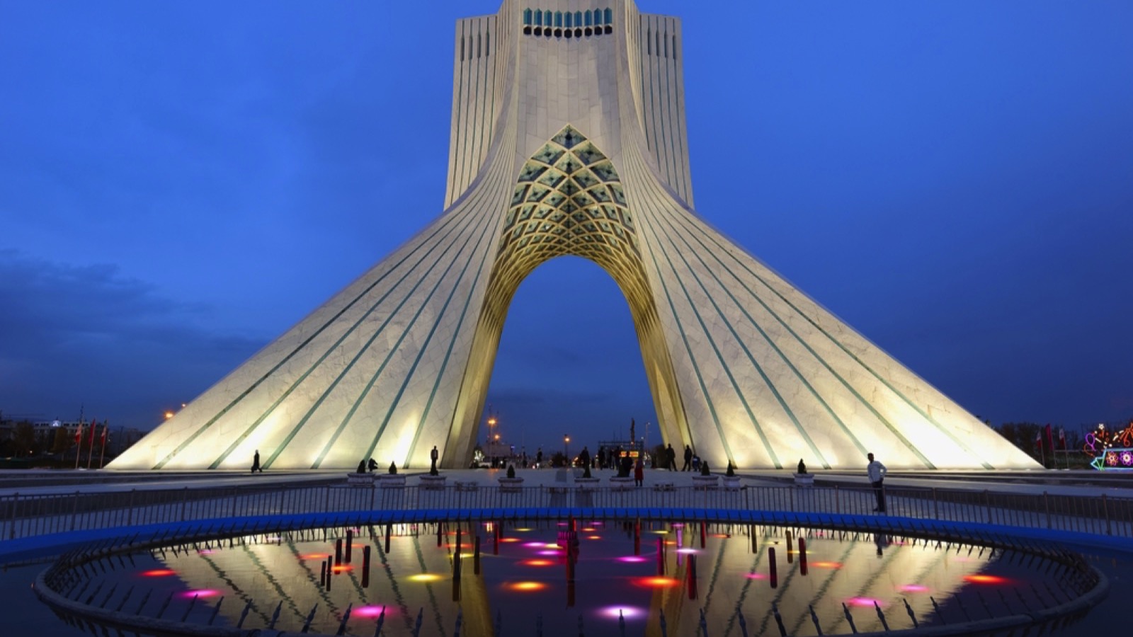 Freedom Monument known as Azadi Tower or Borj-e Azadi tower and cultural complex reflecting in a pond at sunset, Tehran, Islamic Republic of Iran