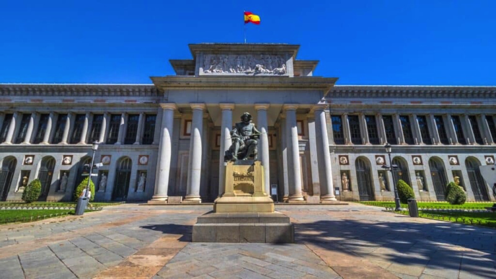 Entrance of the Museo del Prado (The Prado Museum), statue of Diego Rodríguez de Silva y Velázquez, Spanish painter, Madrid, Spain.