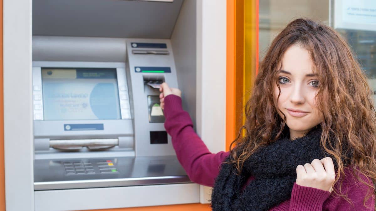 woman at bank machine