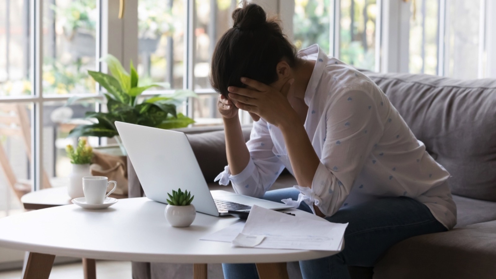 Woman feeling stressed at home