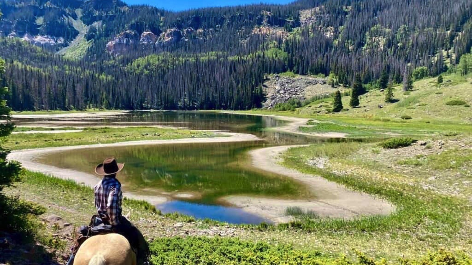 man on horse at dude ranch