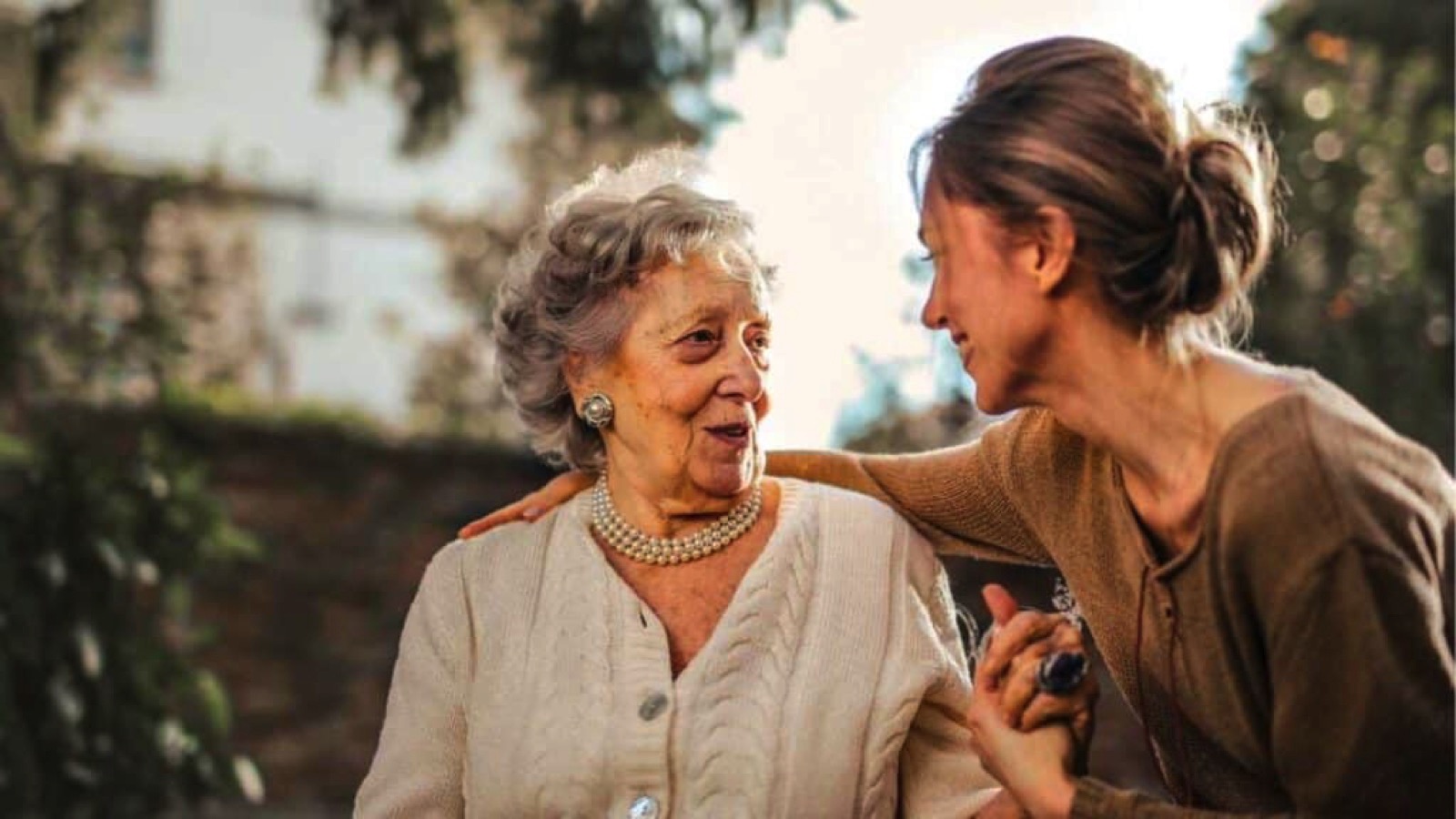 old woman and a young woman talking to each other