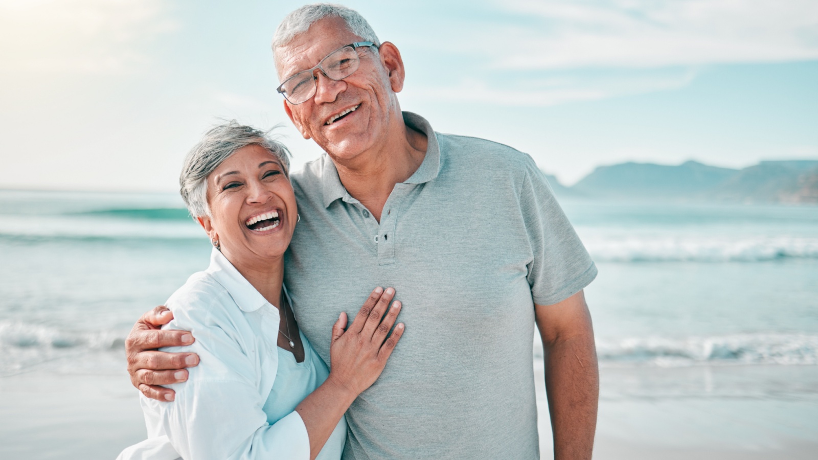 retired senior couple on beach