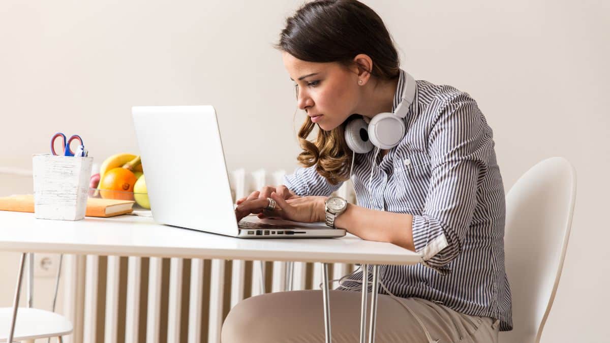 Attractive young woman working on her blog