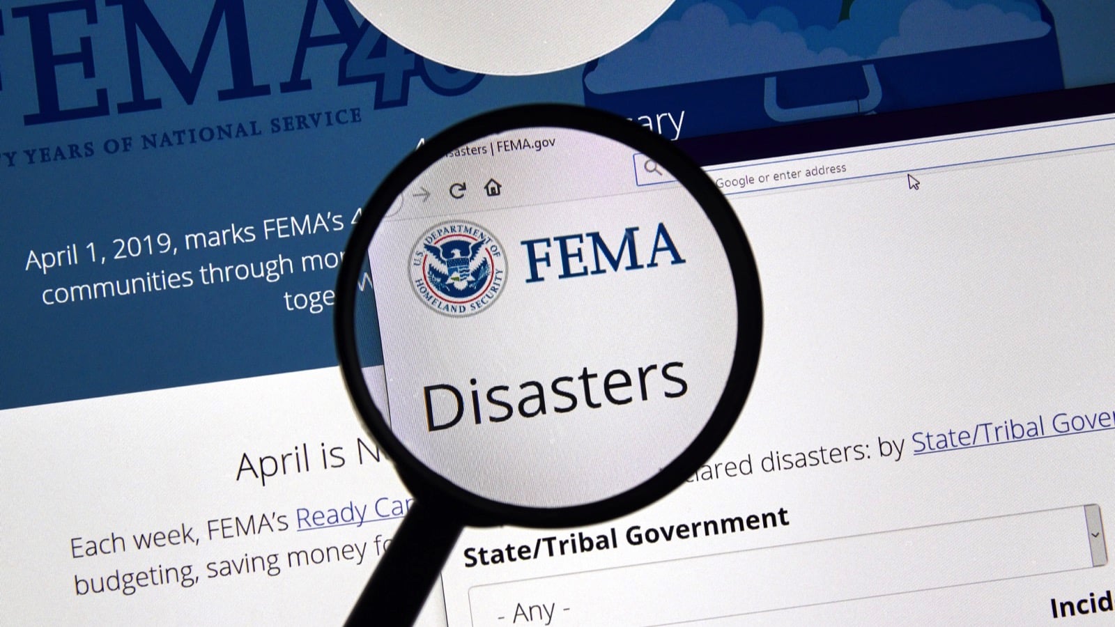 MONTREAL, CANADA - APRIL 24, 2019 : Fema.gov Disasters USA Government home page under magnifying glass. FEMA is The Federal Emergency Management Agency