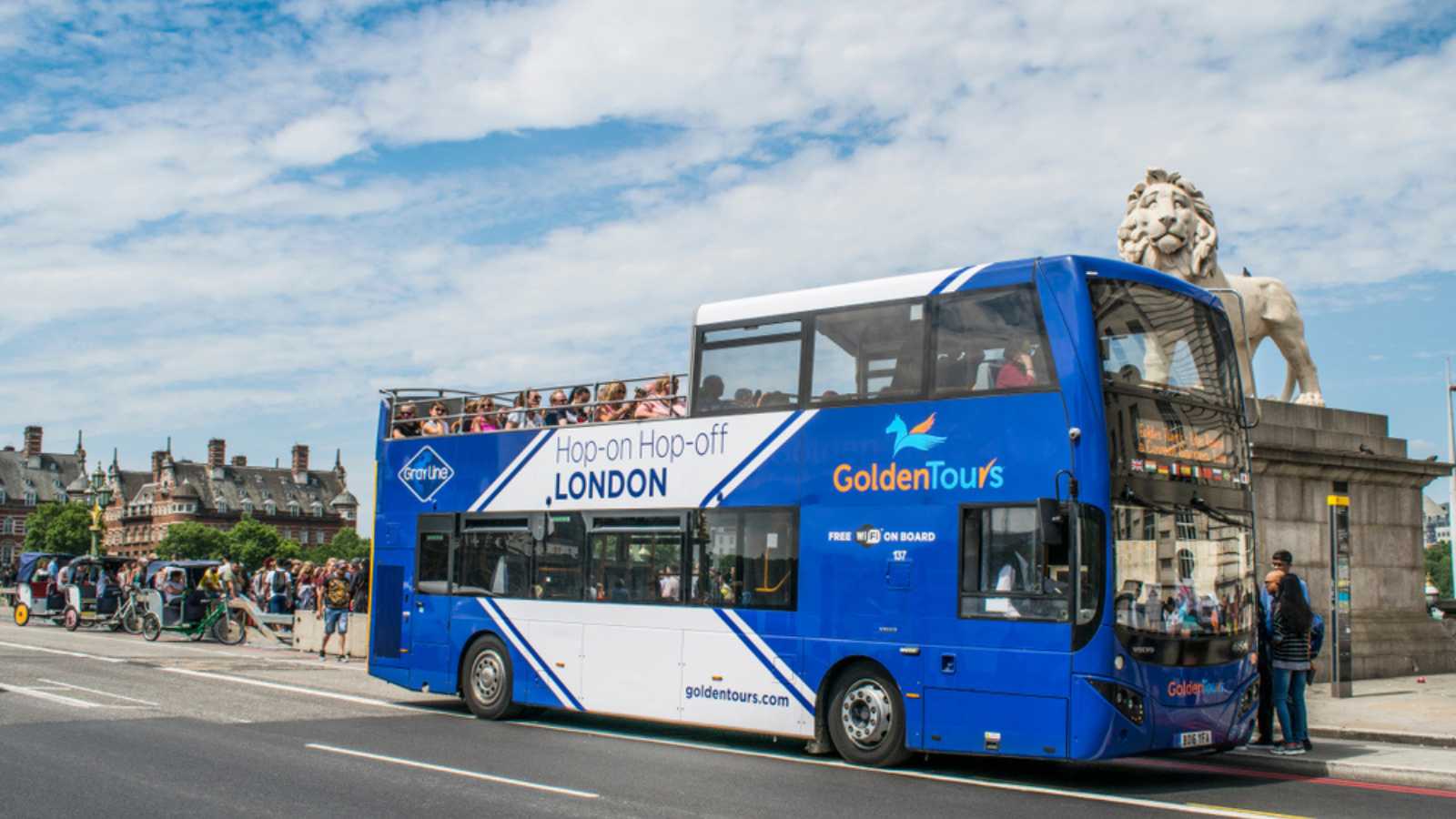 A goldentours sighseeing hop-on hop-off tour bus driving over Westminster Bridge, London, UK taken on 5th July 2019