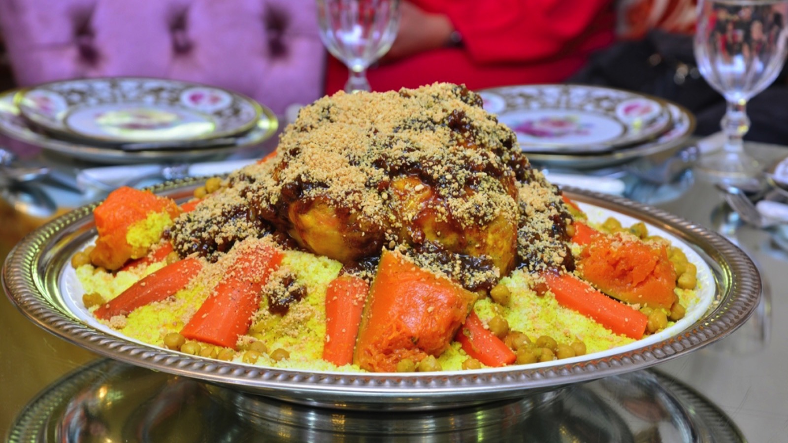 Moroccan couscous with chicken, red squash, carrots and chickpeas. The traditional Arabic couscous.