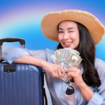 frugal traveler with money and suitcase