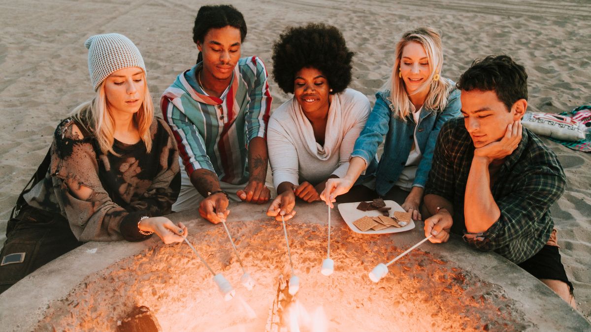 people-melting-smores-over-fire