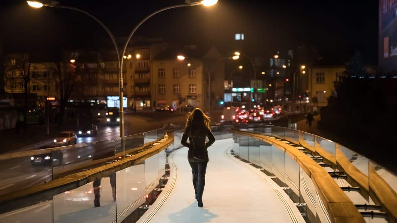 woman-walking-on-dark-street