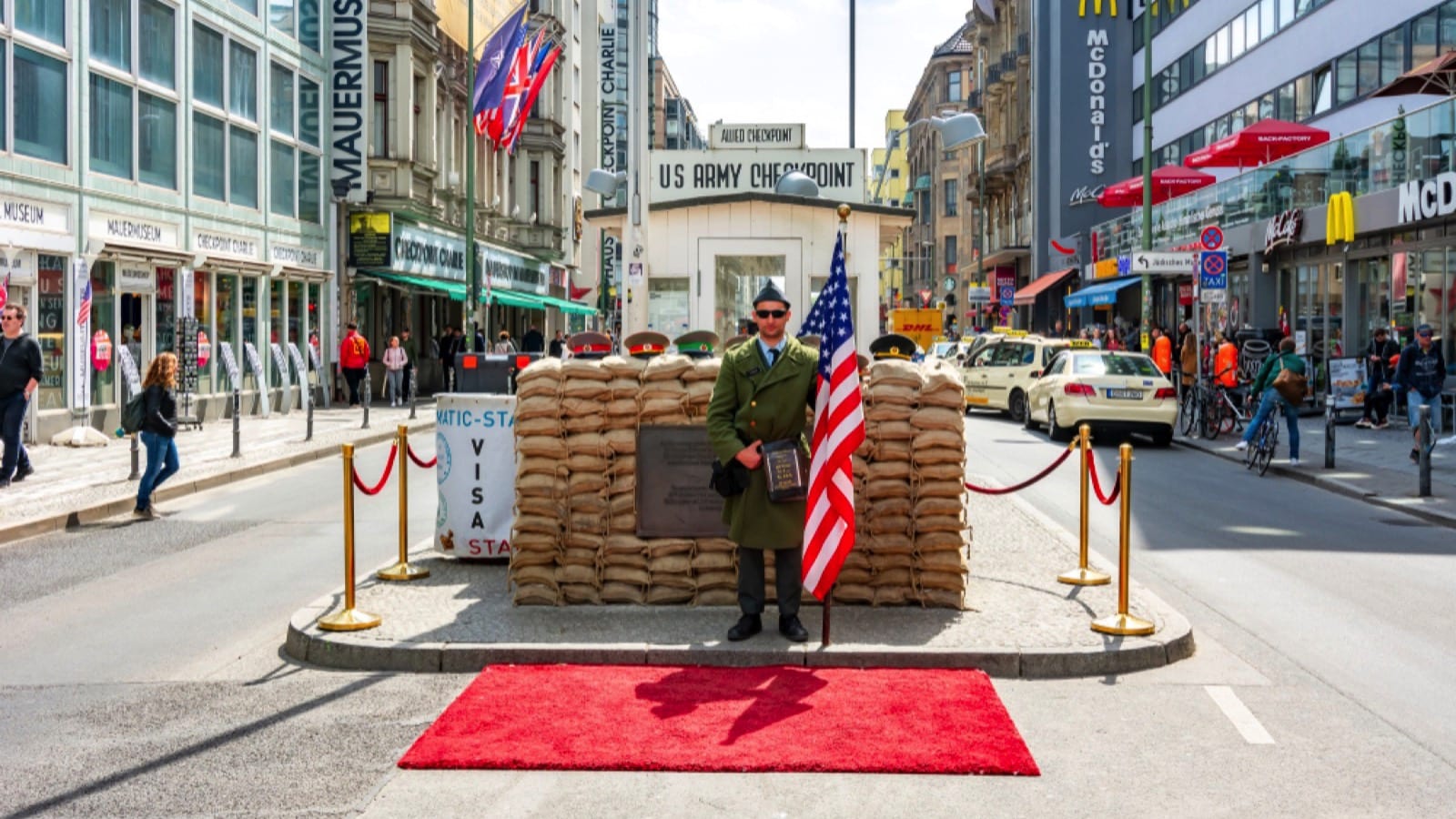 Berlin, Germany - May 2019: Checkpoint Charlie (Berlin Wall crossing point between East and West Berlin during Cold War)