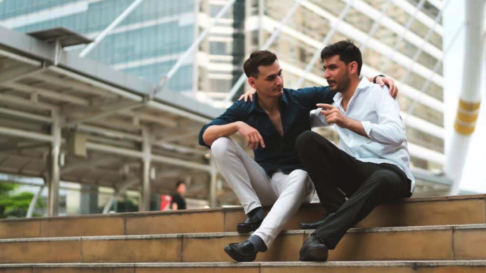 Two friends siting on stairs