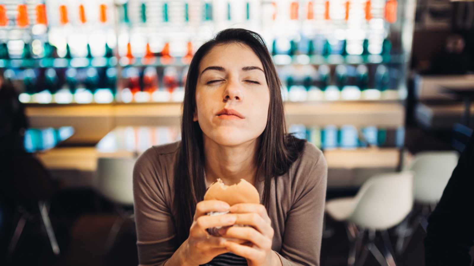 Woman-eating-burger