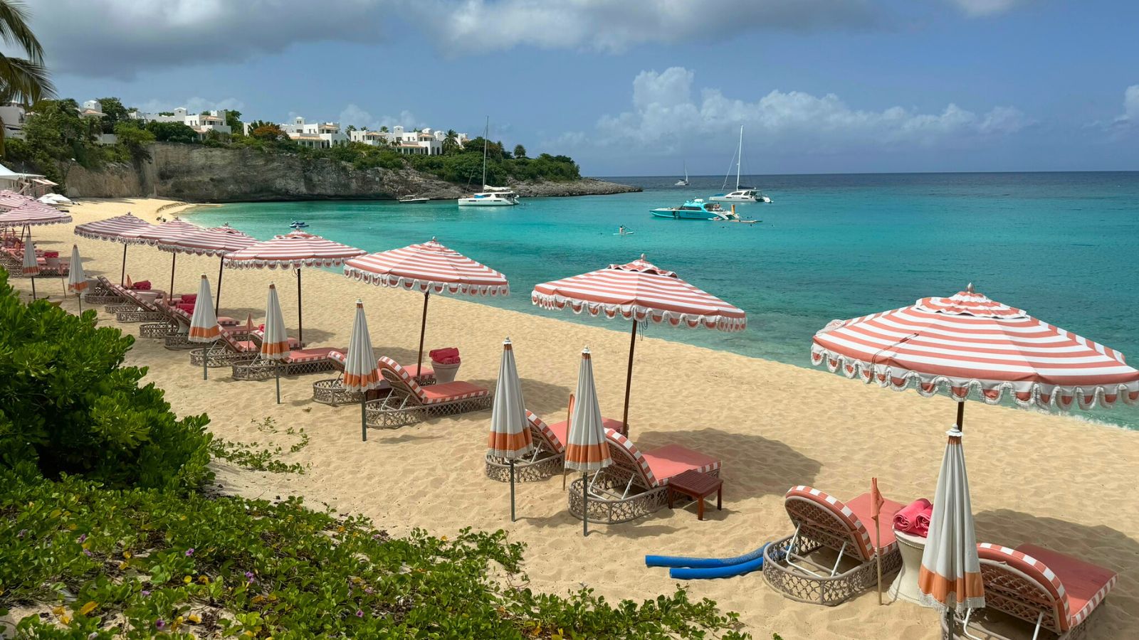 red striped umbrellas on beach in st martin