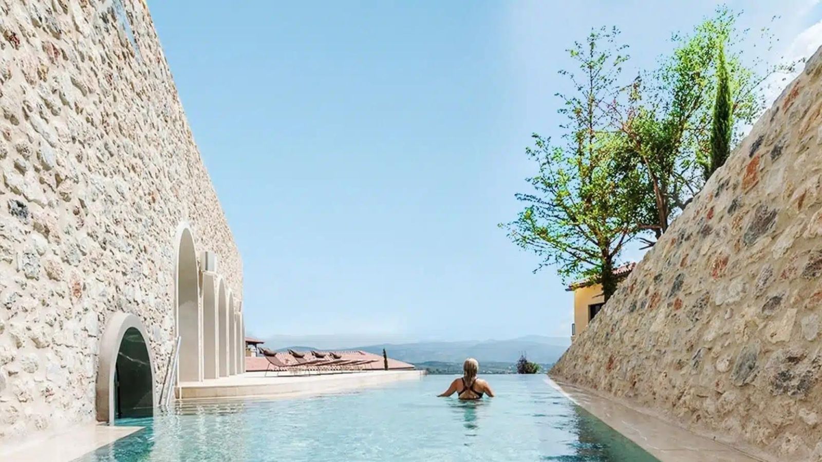 woman in pool at euphria retreat in mystras greece