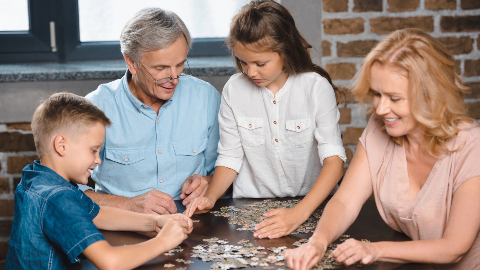 family doing jigsaw puzzle