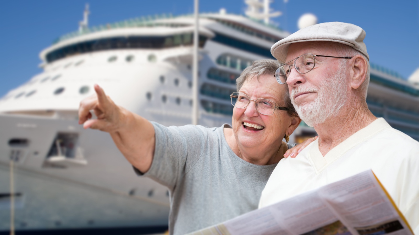 mature couple taking cruise map