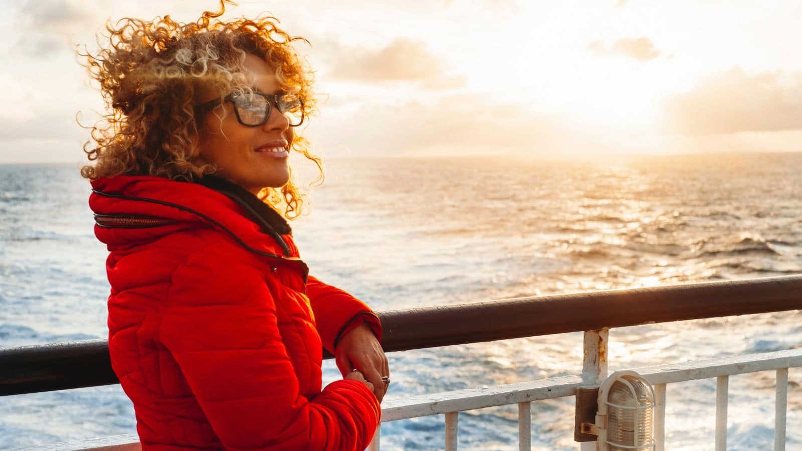 woman in red jacket on cruise ship