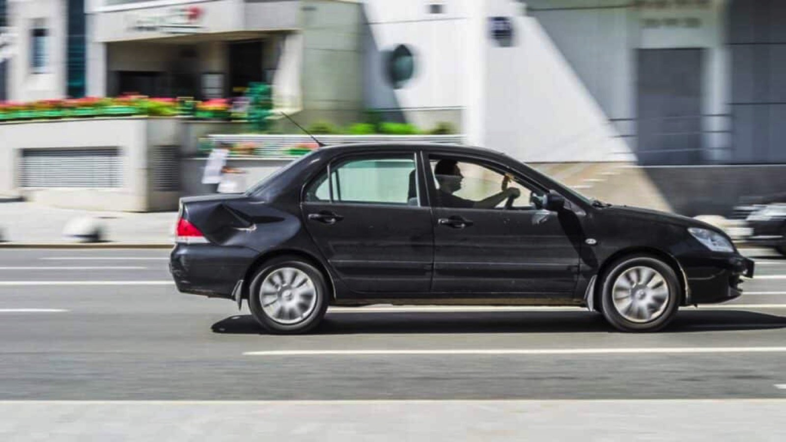 Man driving car fast