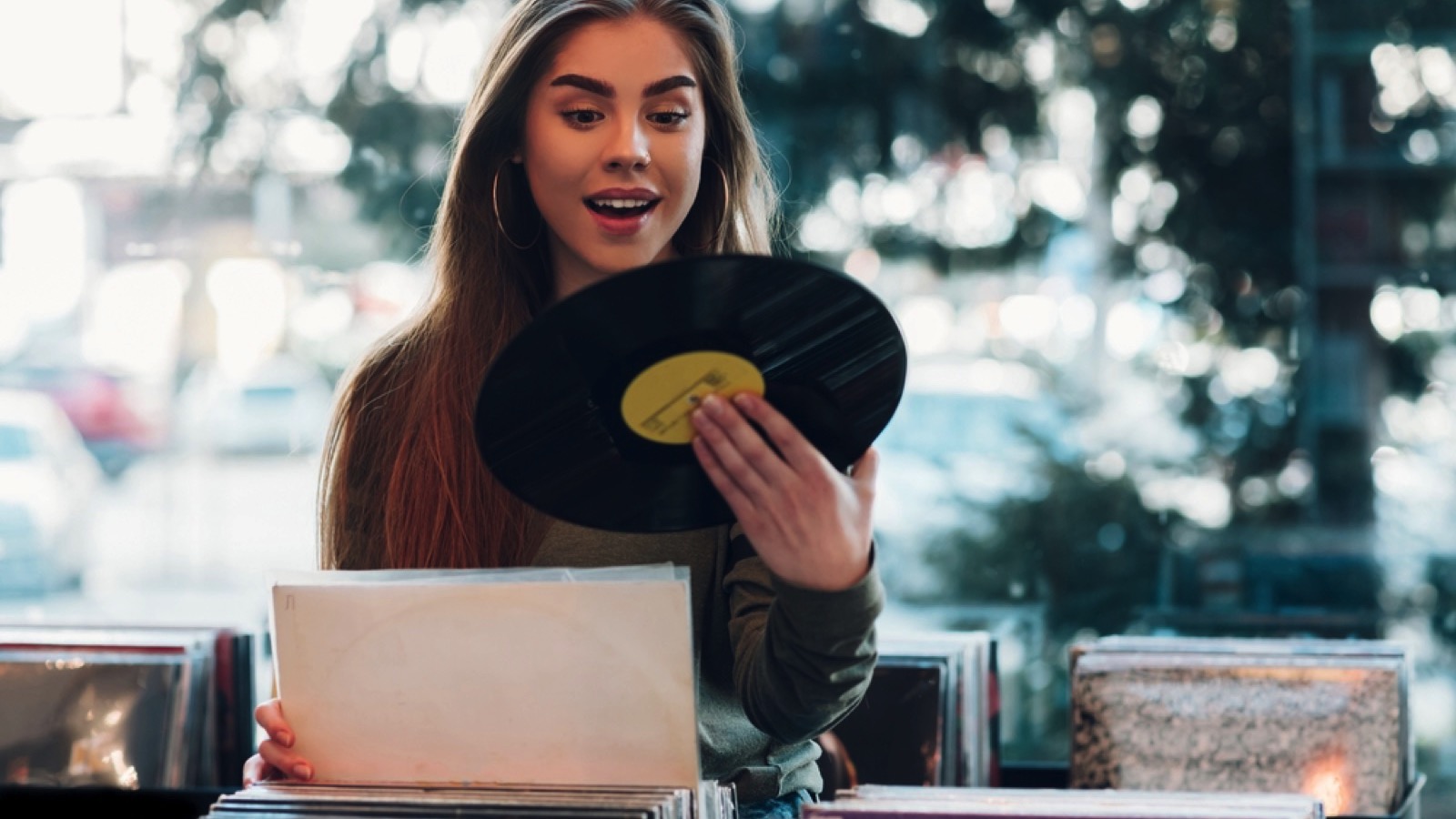 Woman choosing vinyl record