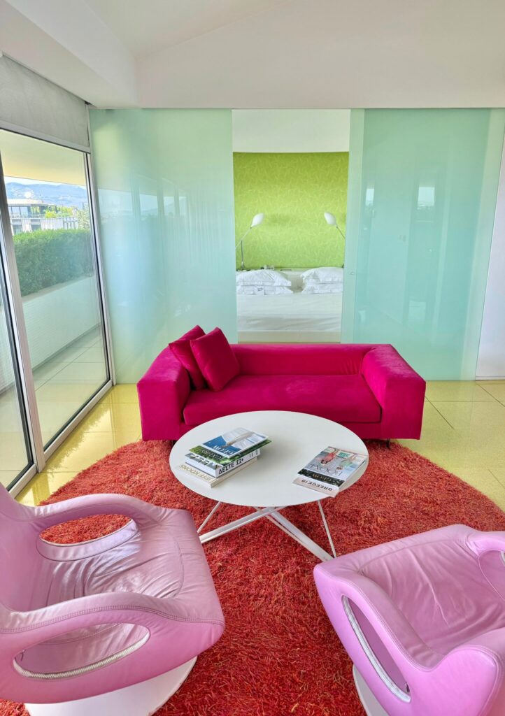 design hotel with pink seating in kifisa Greece